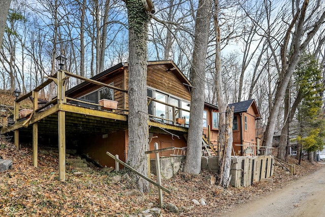 view of property exterior with a deck