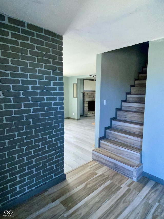 staircase featuring hardwood / wood-style floors