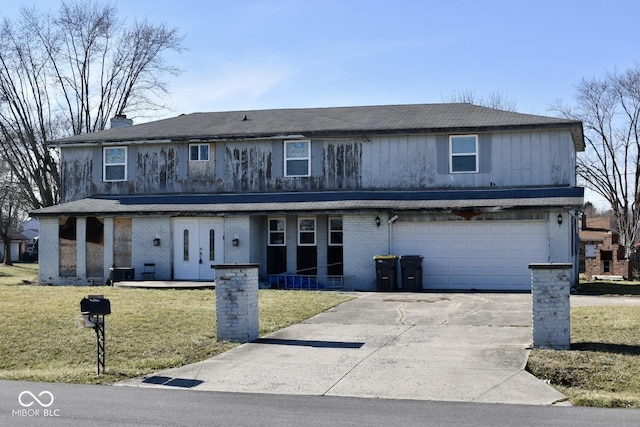 front of property with a garage and a front lawn