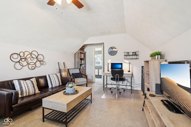 living room with ceiling fan, lofted ceiling, and light carpet