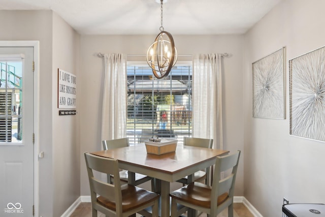 dining space featuring an inviting chandelier