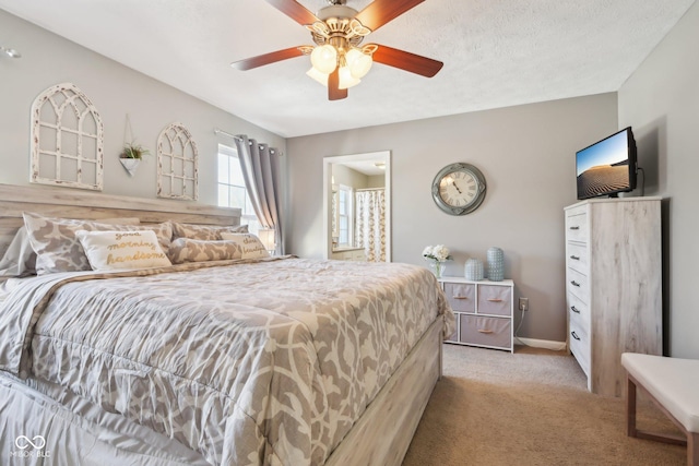 carpeted bedroom with ceiling fan and a textured ceiling