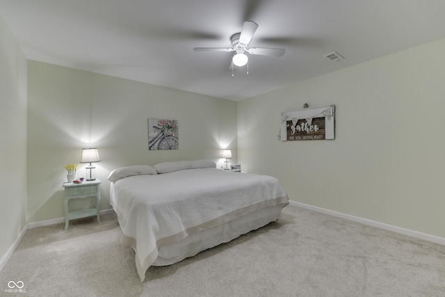 bedroom featuring ceiling fan and light carpet