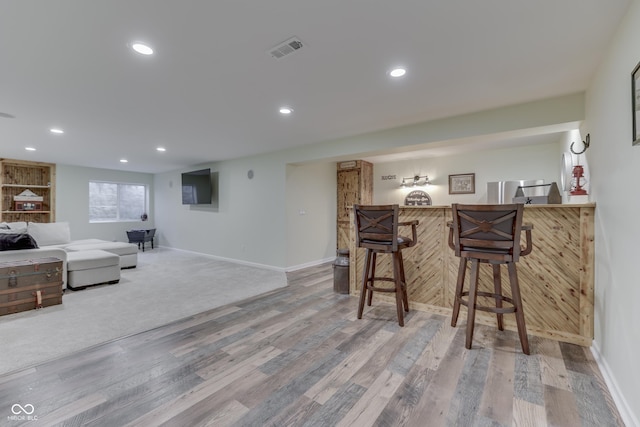 bar featuring wood-type flooring