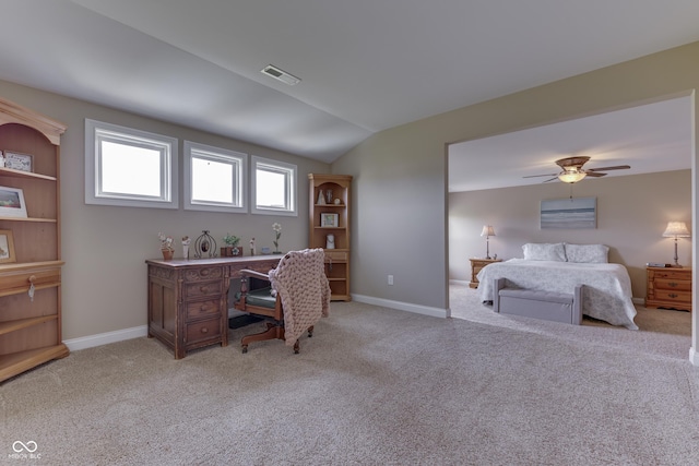 bedroom featuring ceiling fan, light carpet, and vaulted ceiling