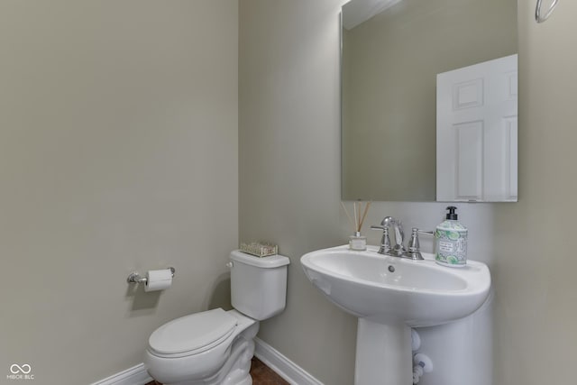 bathroom with toilet and sink