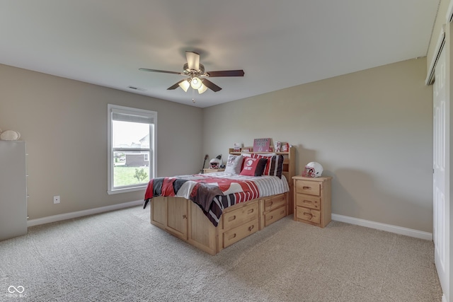 carpeted bedroom with ceiling fan