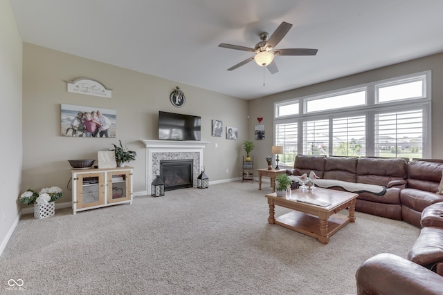 living room with light carpet and ceiling fan