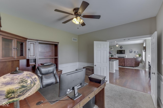 office space featuring ceiling fan and hardwood / wood-style flooring