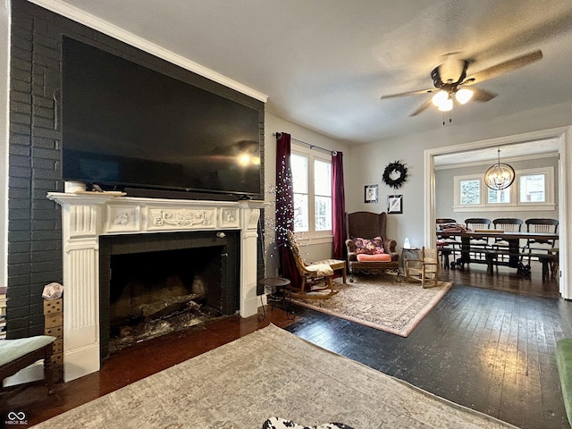 living room with ceiling fan, dark wood-type flooring, and a fireplace