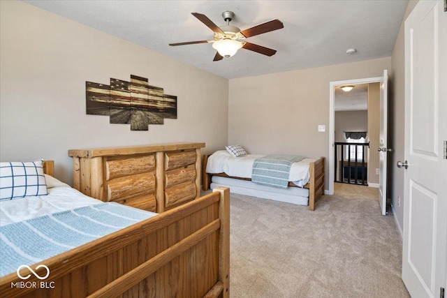 bedroom with light colored carpet and ceiling fan