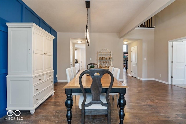 dining area with dark hardwood / wood-style flooring