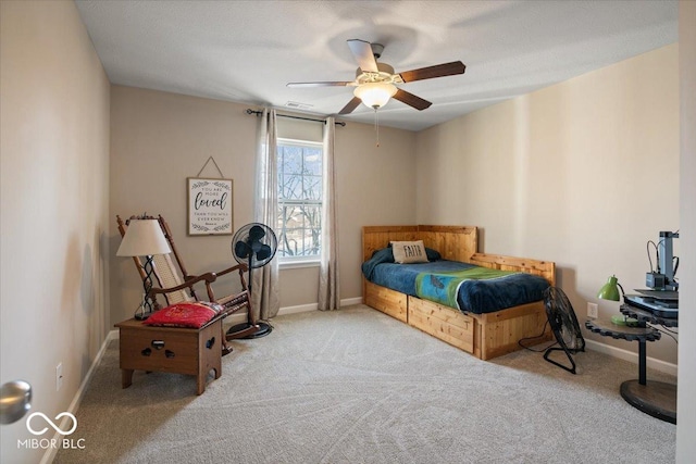 bedroom featuring light colored carpet and ceiling fan