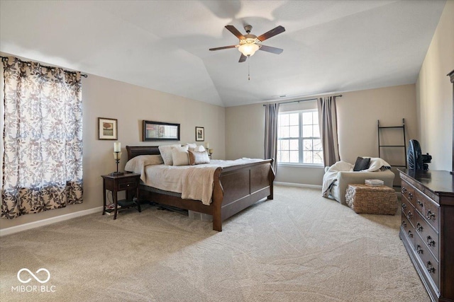 carpeted bedroom featuring ceiling fan and vaulted ceiling