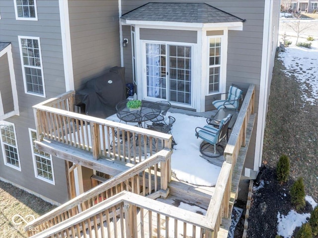 wooden deck with a patio