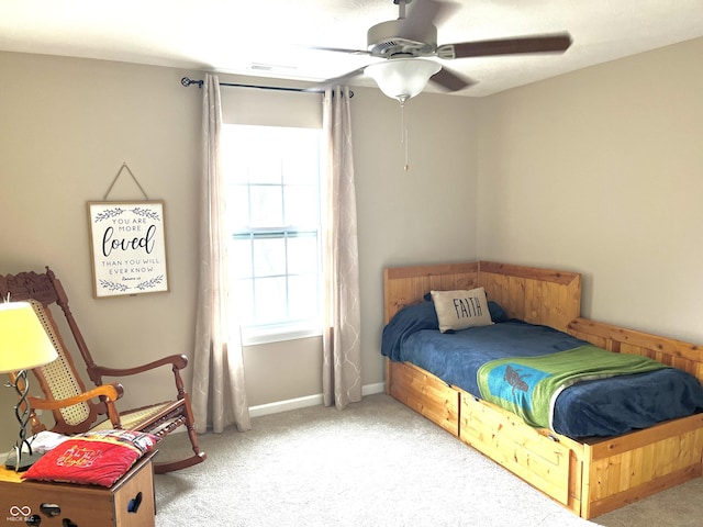 bedroom with light colored carpet and ceiling fan