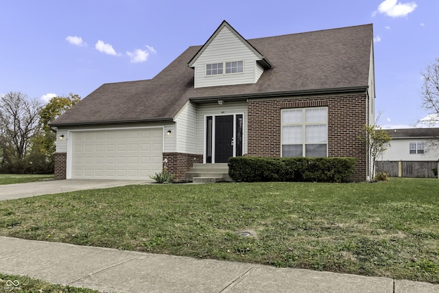 view of front of house featuring a garage and a front lawn