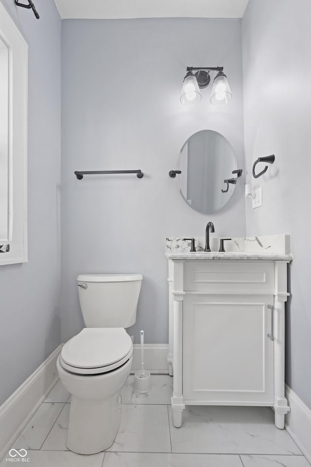 bathroom with toilet and vanity