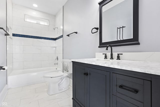 full bathroom featuring toilet, tiled shower / bath combo, and vanity