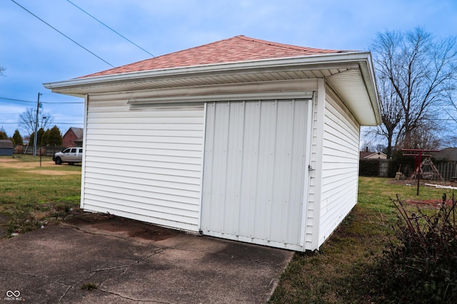 view of outdoor structure with a lawn