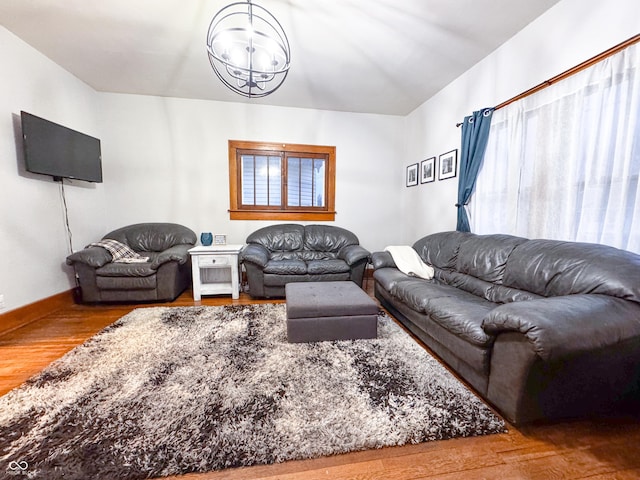 living room featuring hardwood / wood-style floors and a notable chandelier