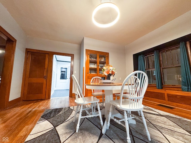 dining room with light hardwood / wood-style flooring