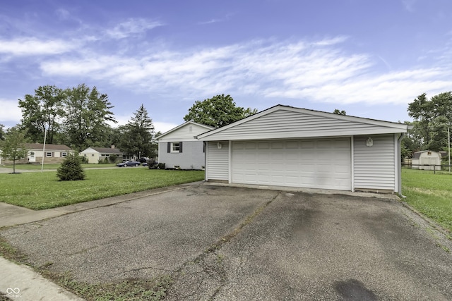 garage with a lawn