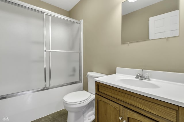 full bathroom with tile patterned floors, enclosed tub / shower combo, vanity, and toilet