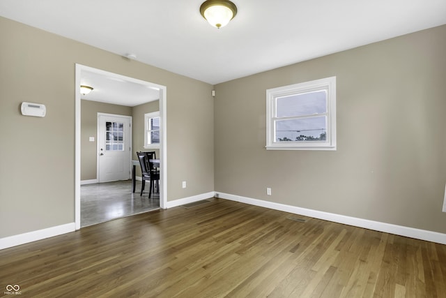 unfurnished room featuring wood-type flooring