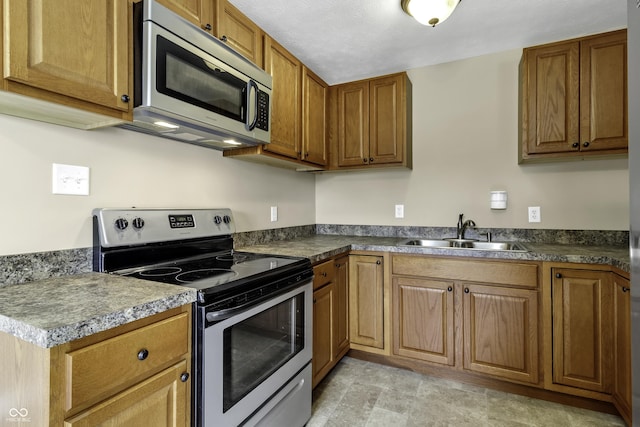 kitchen featuring stainless steel appliances and sink