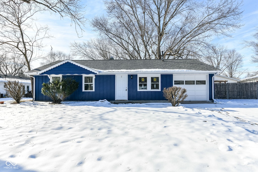 single story home featuring a garage