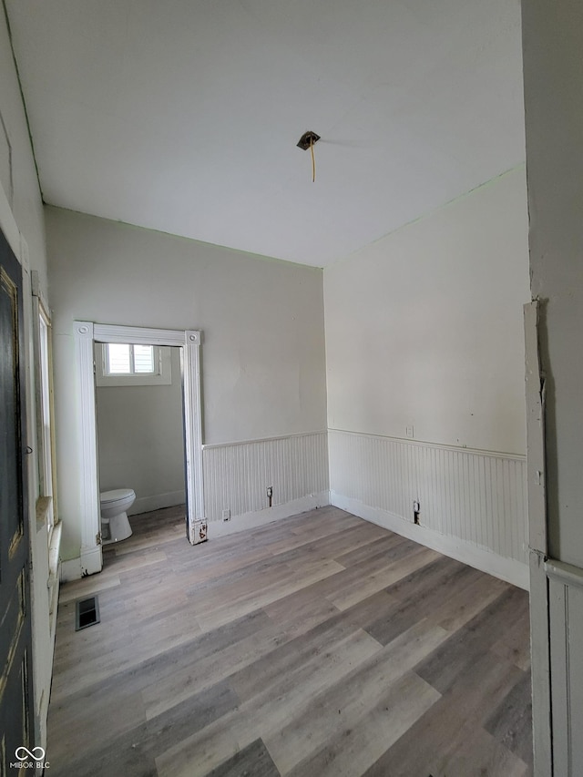 empty room with light hardwood / wood-style flooring