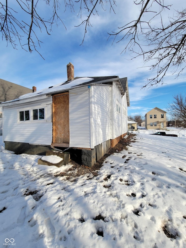 view of snow covered house