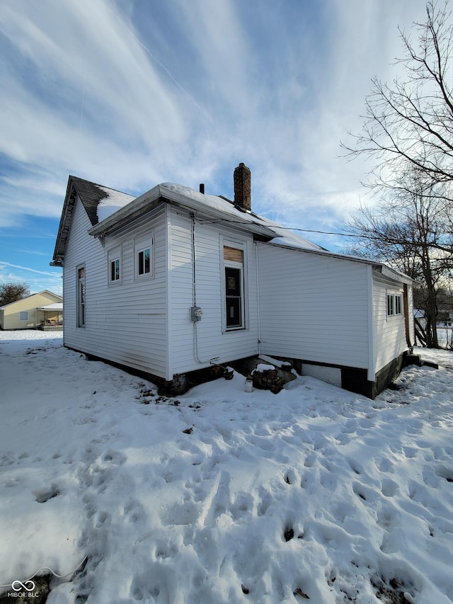 view of snow covered property