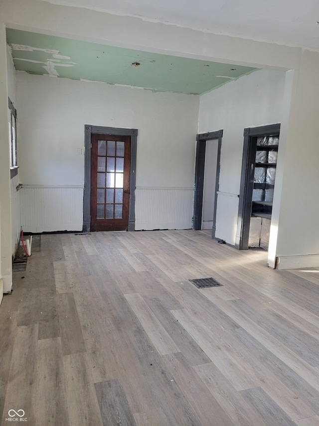 spare room featuring light hardwood / wood-style flooring