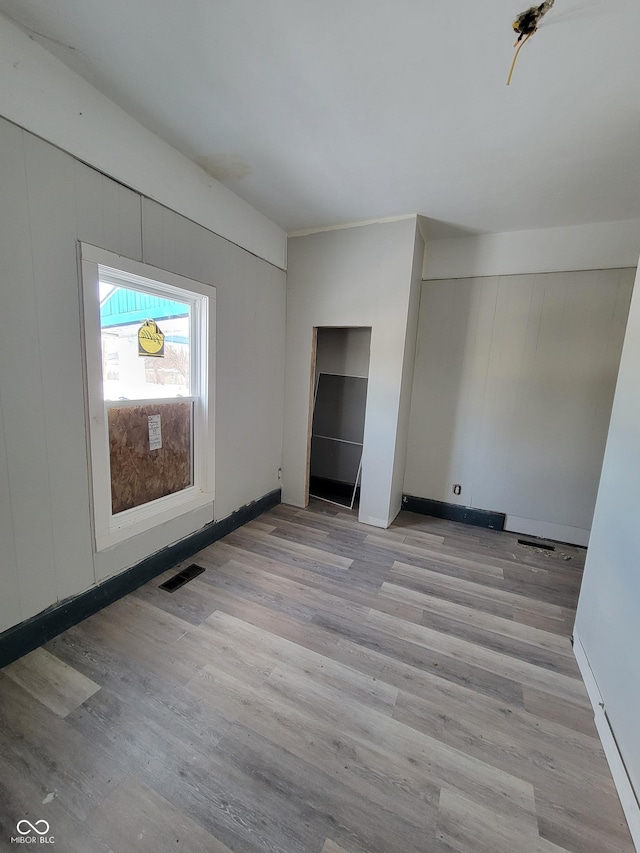 unfurnished bedroom featuring light hardwood / wood-style flooring