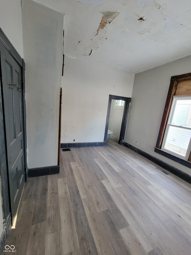 empty room with light wood-type flooring