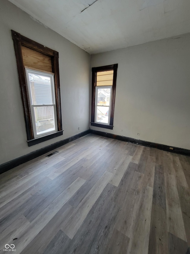 spare room with light wood-type flooring