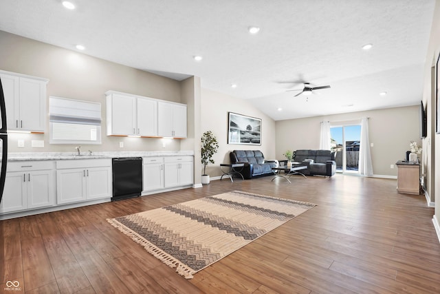 kitchen with white cabinetry, dishwasher, and dark hardwood / wood-style floors