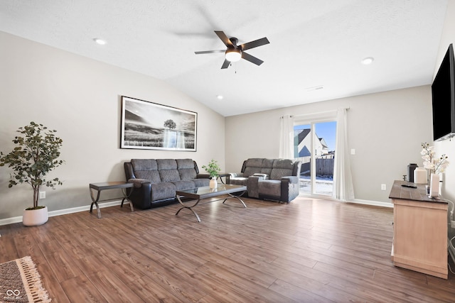 living room featuring a textured ceiling, ceiling fan, lofted ceiling, and hardwood / wood-style flooring