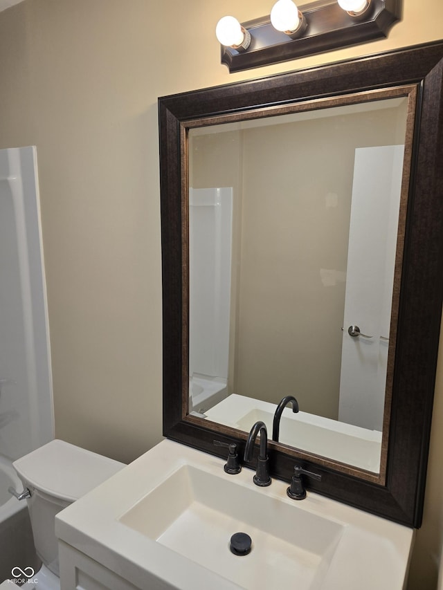 bathroom with toilet and vanity