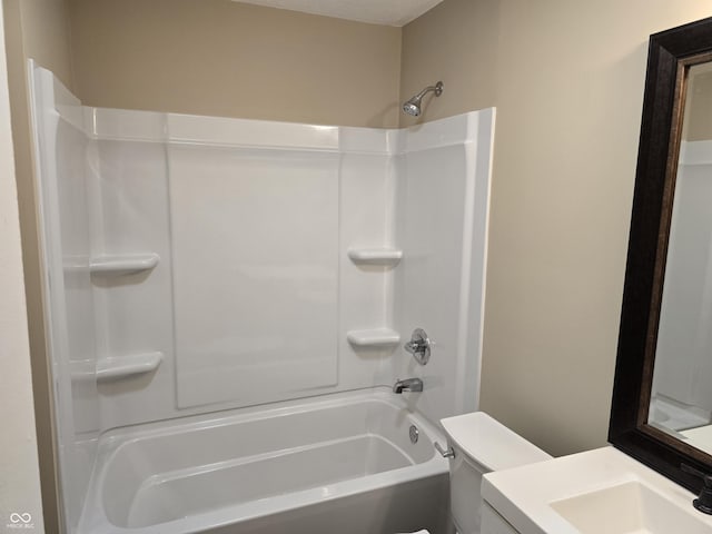 full bathroom with toilet, vanity, and shower / tub combination