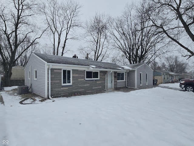 ranch-style home with central air condition unit