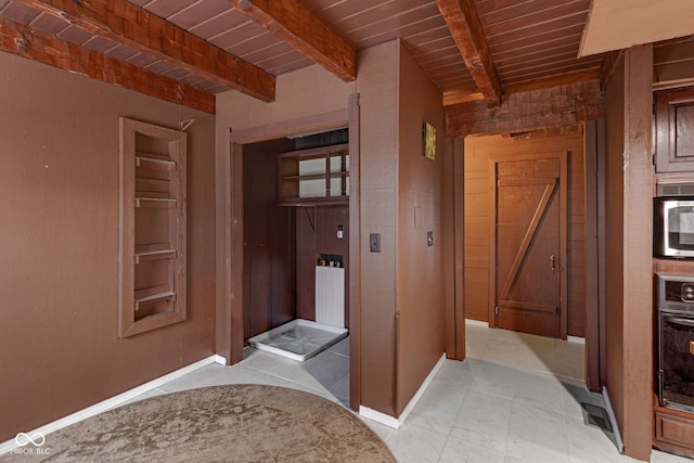 hallway featuring wooden ceiling and beam ceiling