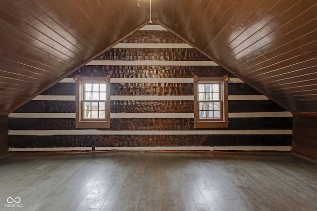 additional living space featuring hardwood / wood-style flooring, lofted ceiling, and wood ceiling