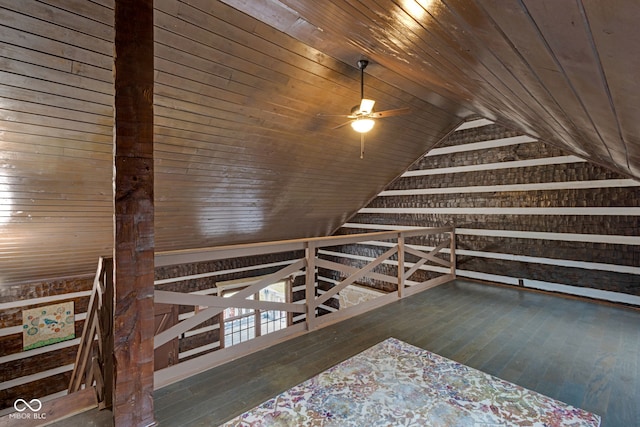 bonus room with hardwood / wood-style floors, wood ceiling, vaulted ceiling, and wooden walls