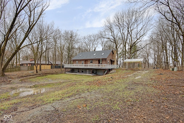 exterior space featuring a wooden deck