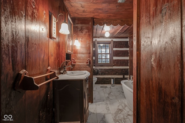 bathroom featuring toilet, wood walls, wood ceiling, vanity, and a bathtub