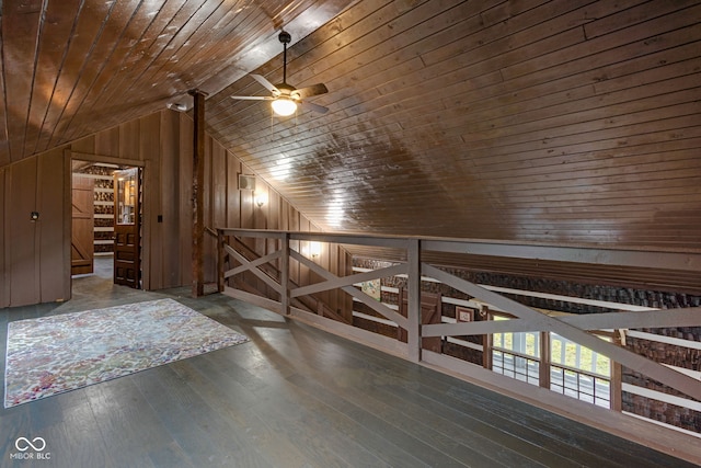 bonus room with hardwood / wood-style flooring, wooden walls, wooden ceiling, and vaulted ceiling