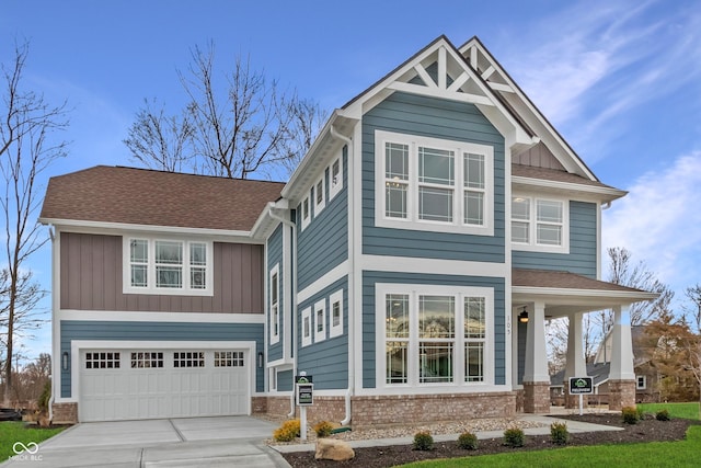 craftsman-style home featuring roof with shingles, brick siding, board and batten siding, and an attached garage